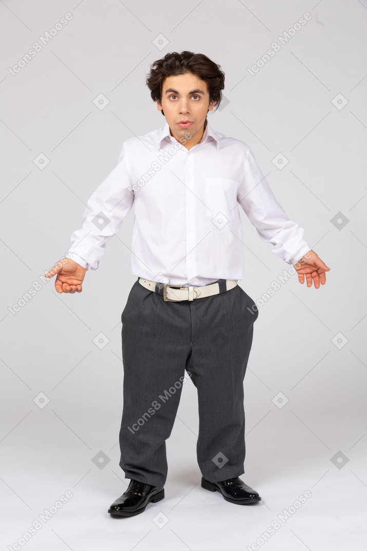 Young man talking and spreading arms