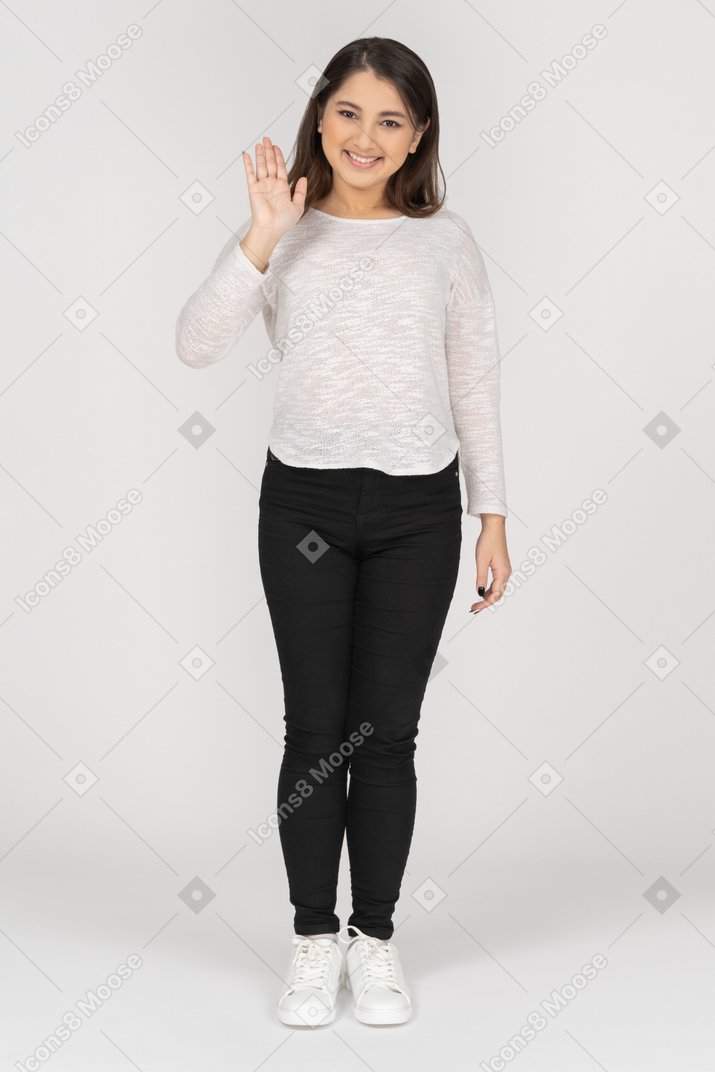 Front view of a greeting young indian female in casual clothing