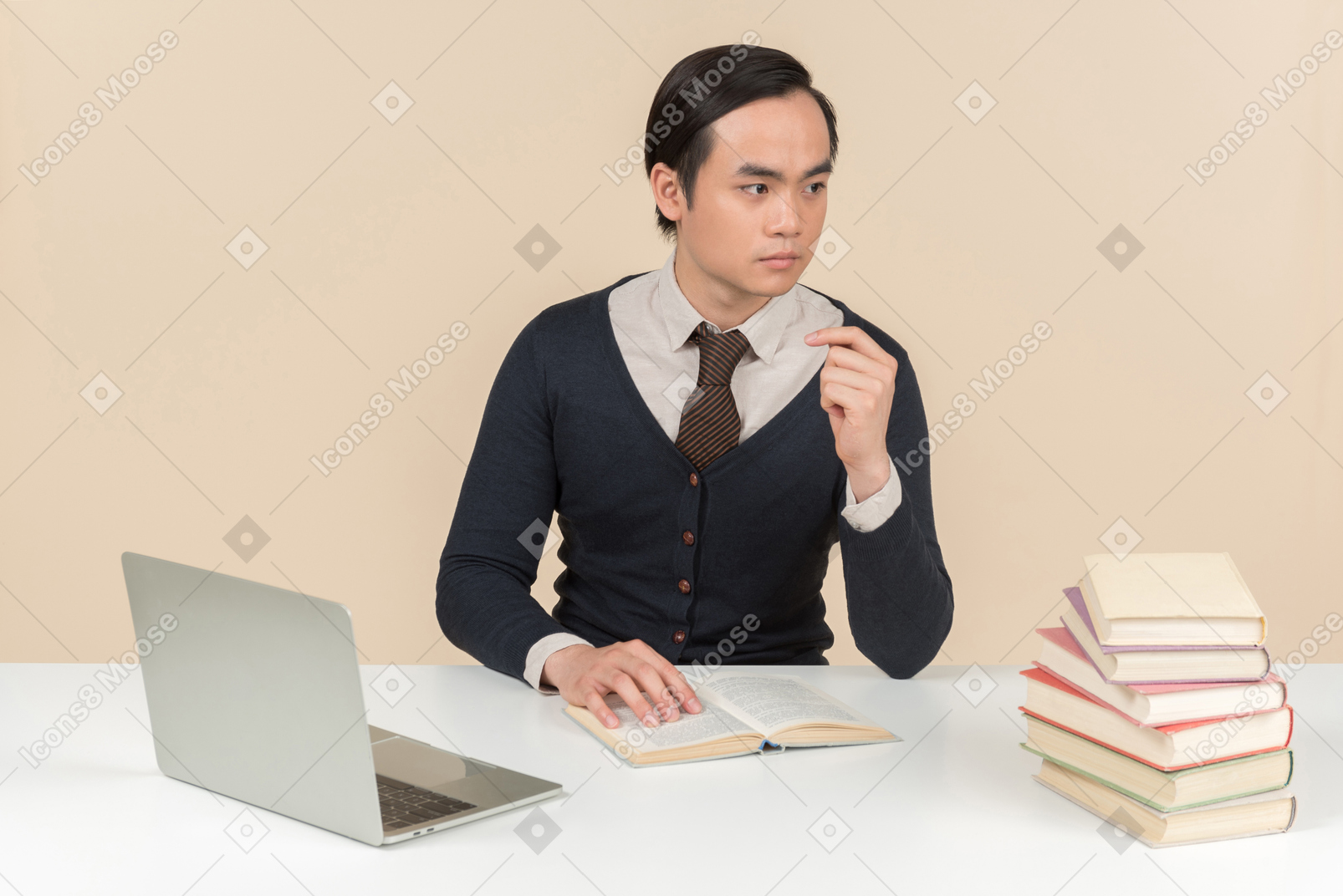 Young asian student thinking while reading a book