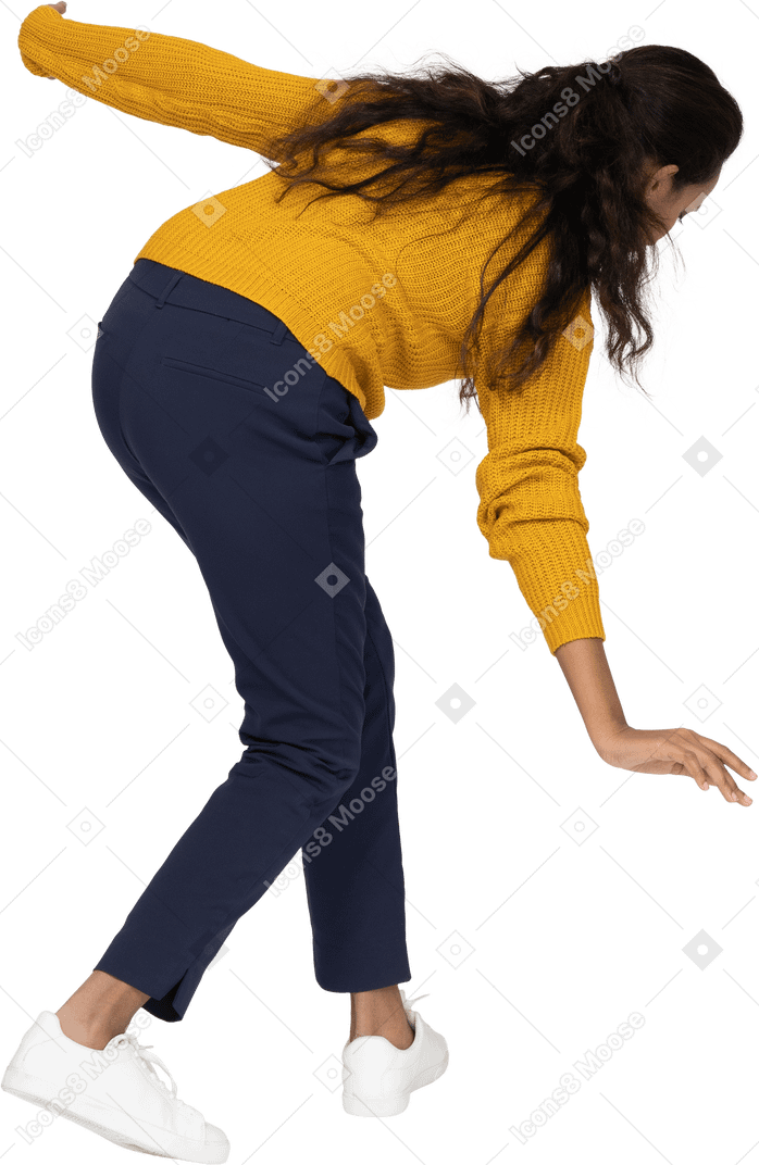 Side view of a girl in casual clothes bending down