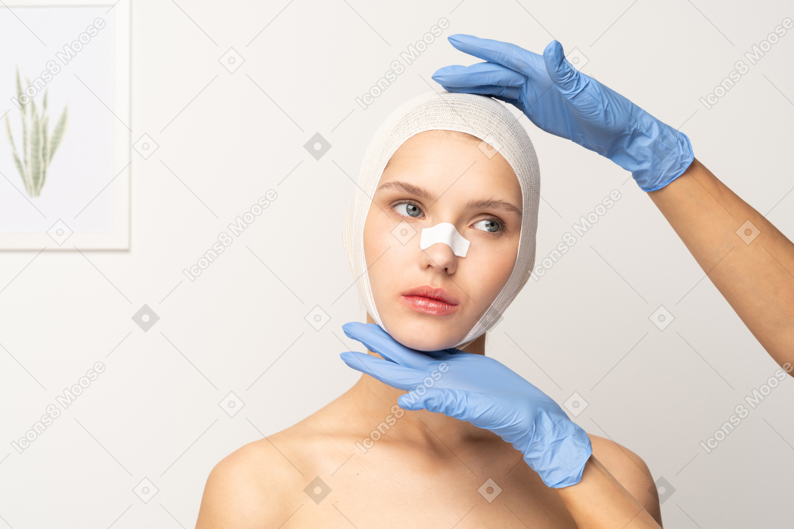 Female patient with gloved hands above and below her face