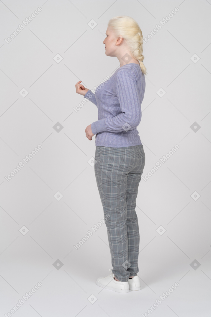 Woman gesturing for someone to come closer