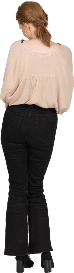Woman in beautiful blouse standing