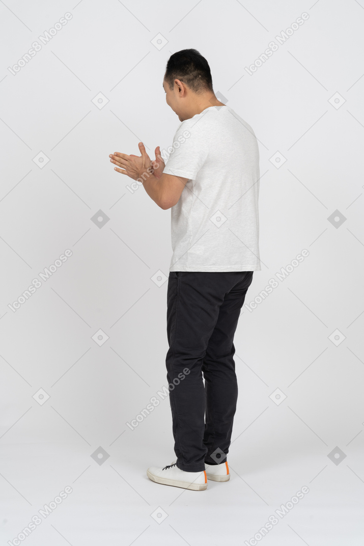 Man in casual clothes rubbing hands