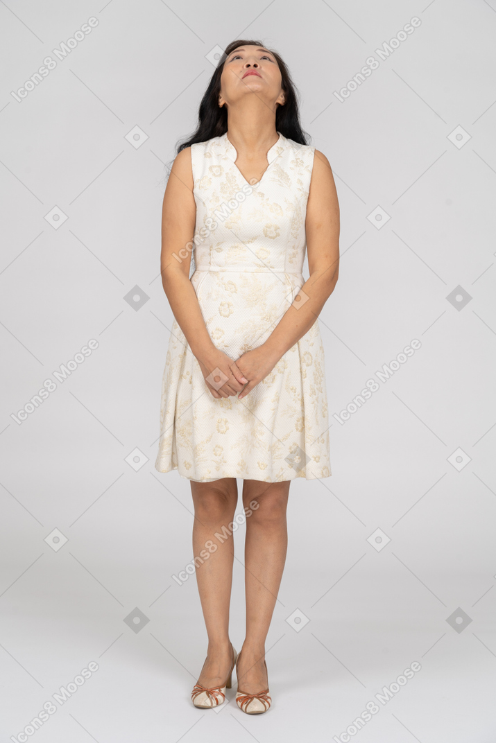 Woman in beautiful dress standing