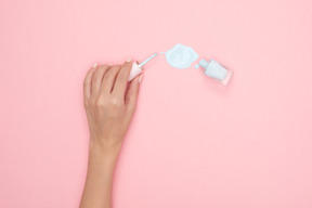 Bottle lying sideways spilling out nail varnish