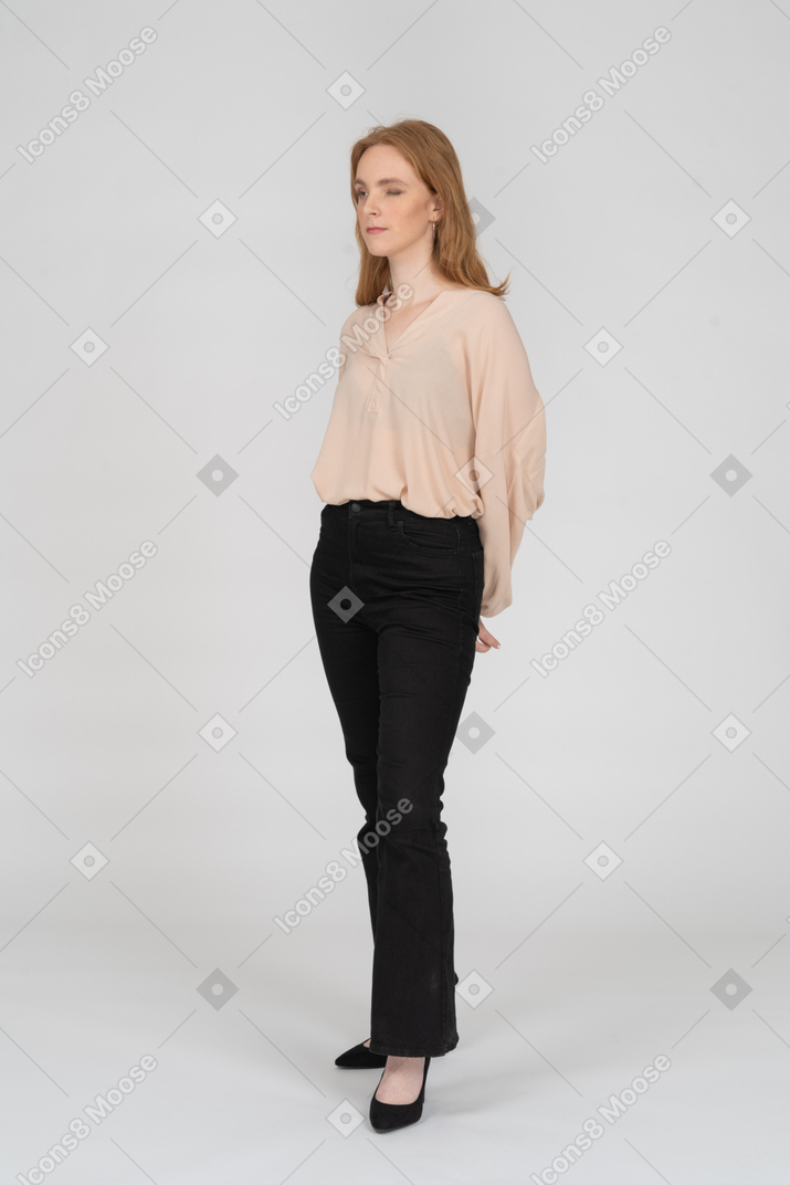 Woman in beautiful blouse standing