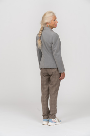 Rear view of an old lady in suit