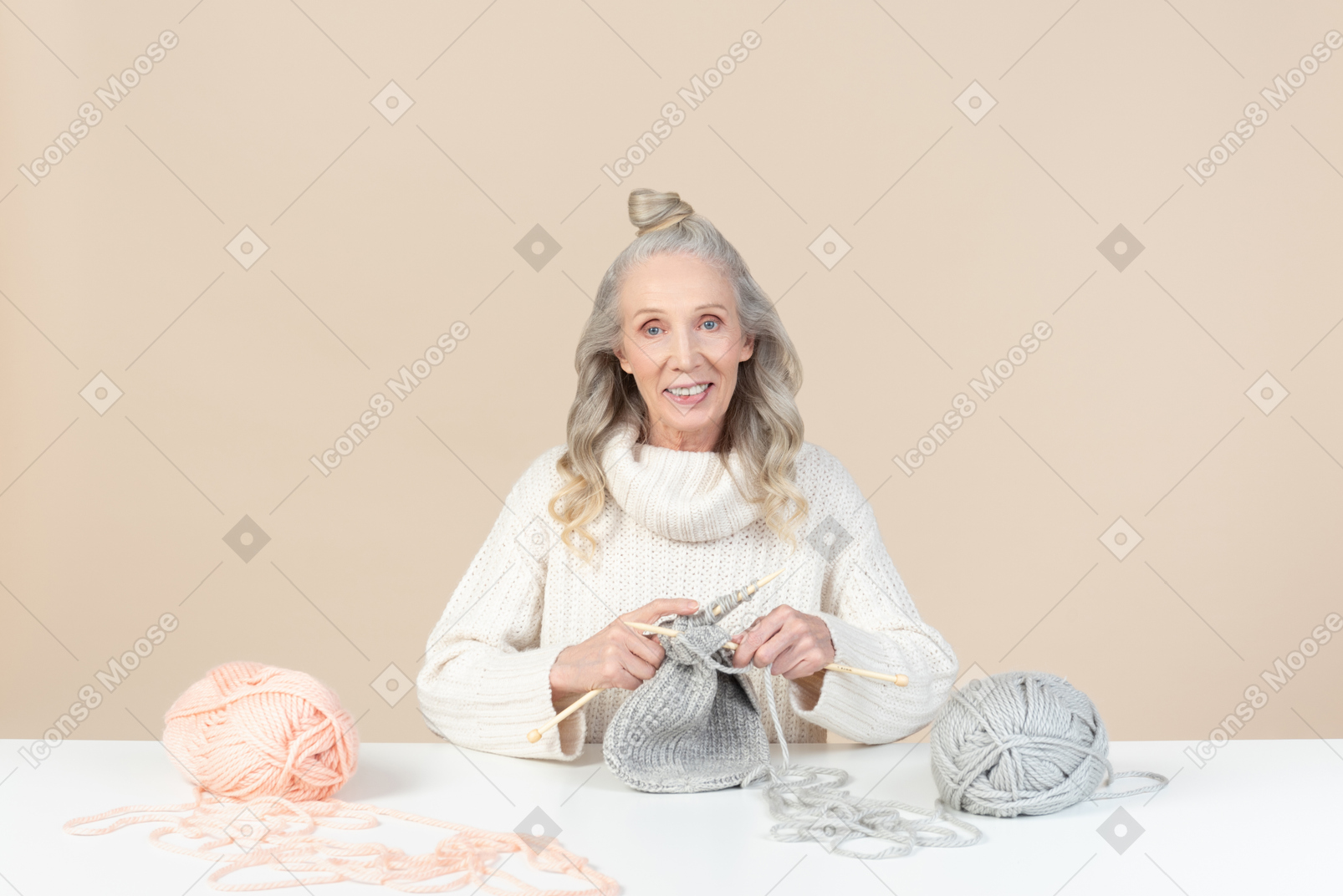 Old woman focused on knitting
