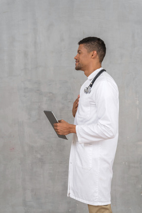 Side view of a male doctor talking