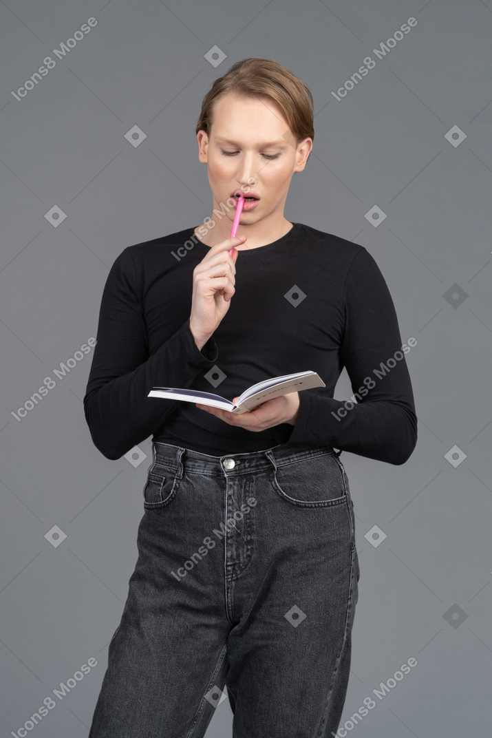 Front view of a person thinking about what to write