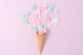 Pastel pinwheels and party horns in an ice cream cone