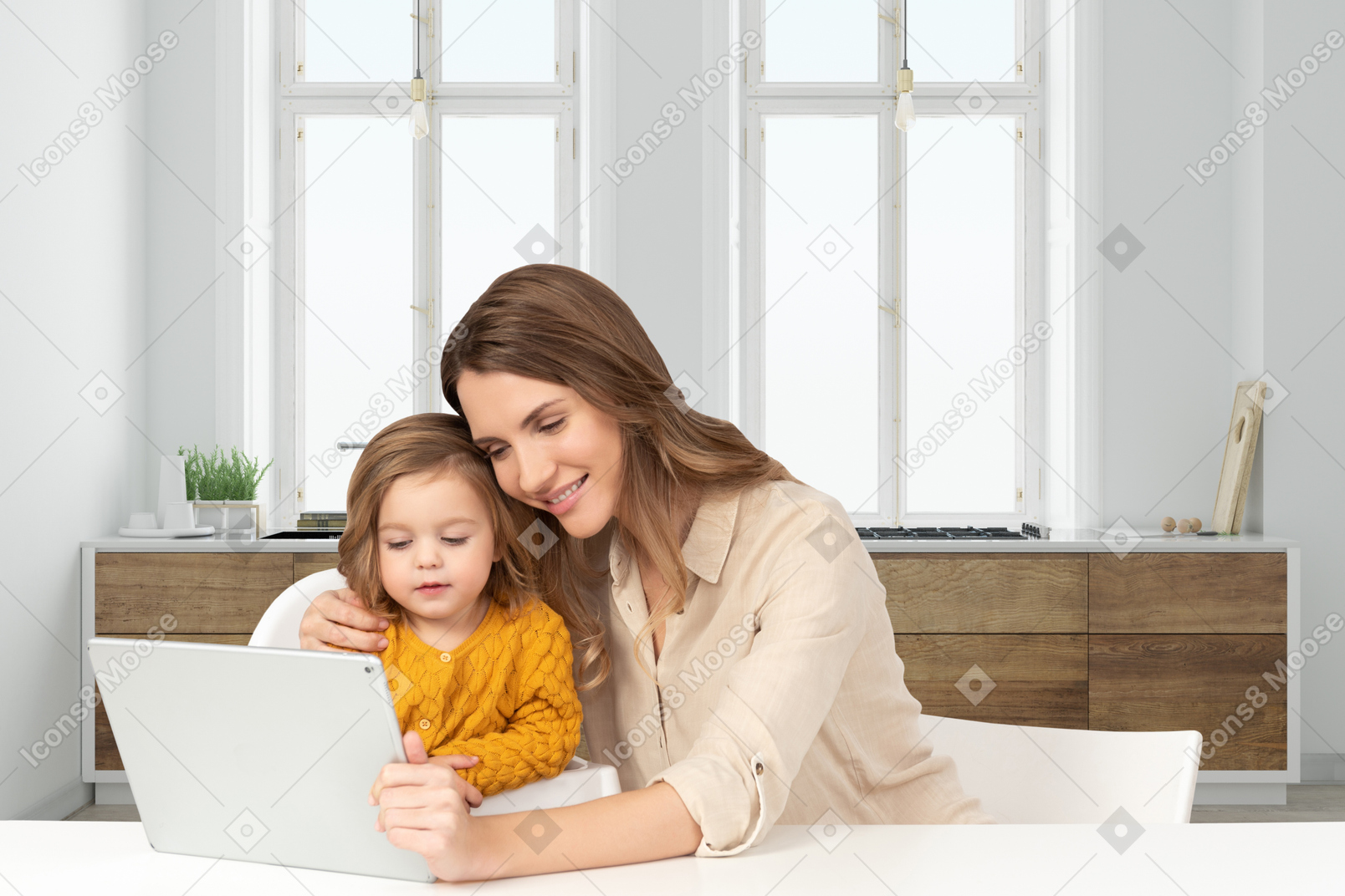 A woman and a child are looking at a laptop
