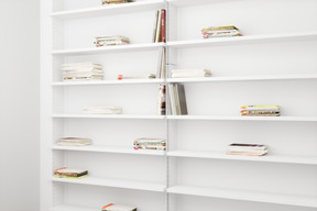 White shelves with books and magazines