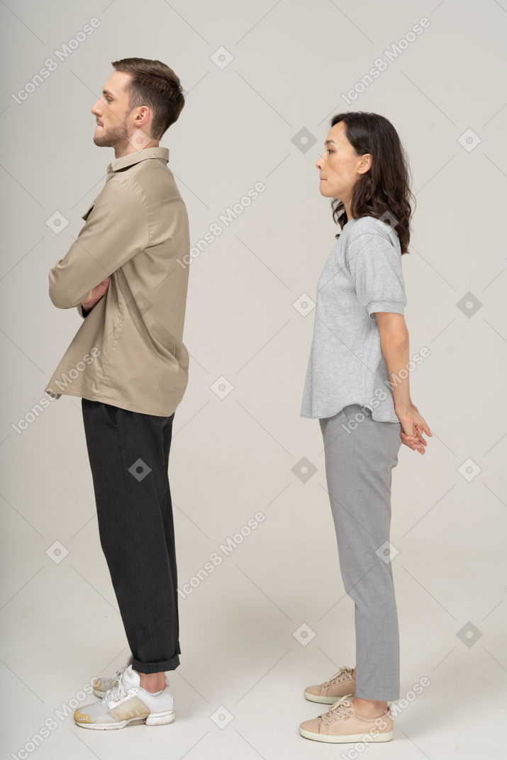 Side view of young couple pouting