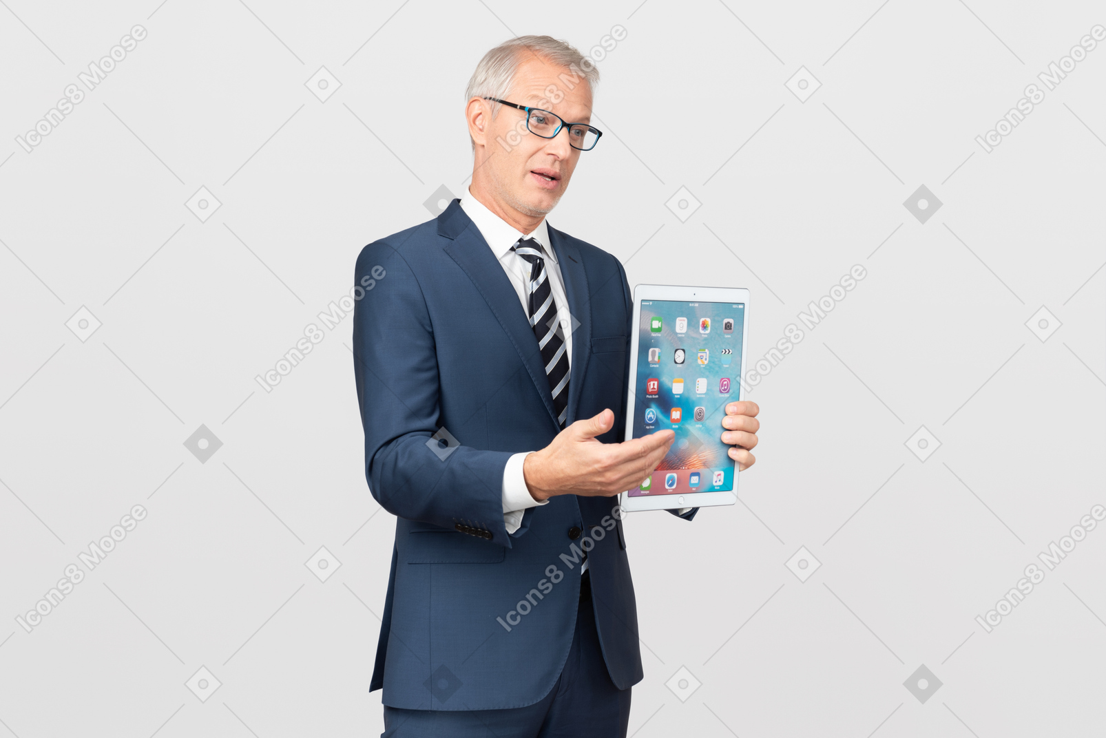 Elegant middle-aged business man showing his tablet