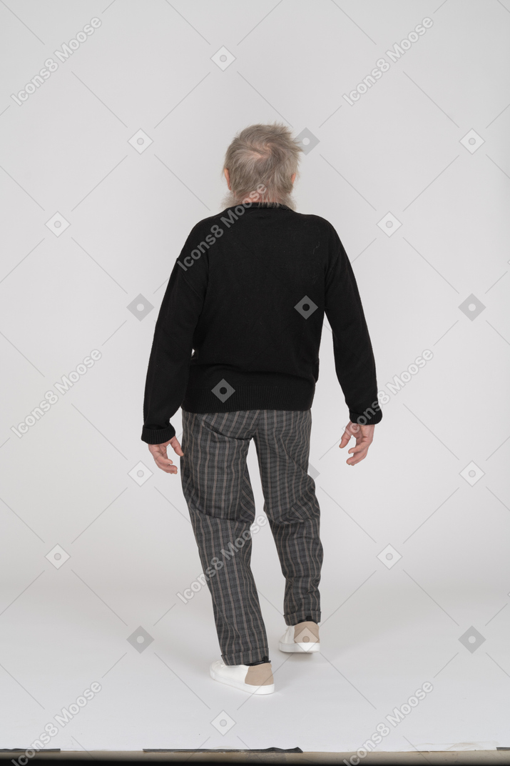 Back view of an elderly man bending back