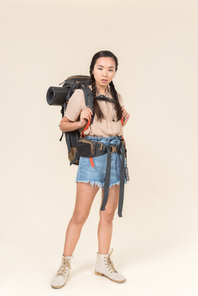 Young woman hiker looking right into camera