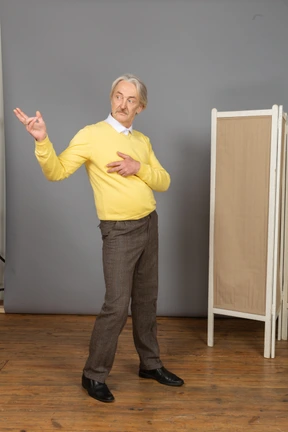 Three-quarter of a gesticulating dancing old female