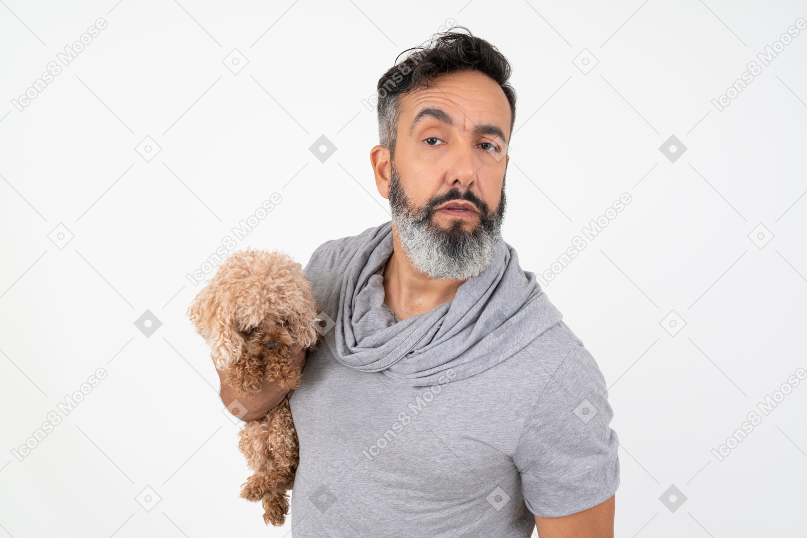 Handsome man holding a puppy