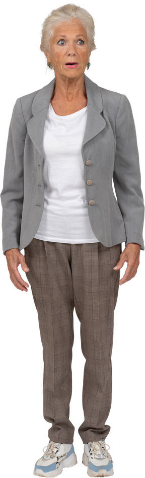 Front view of an shocked old woman in suit