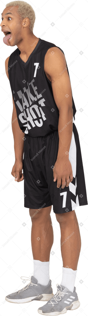 Three-quarter view of a crazy young male basketball player showing tongue