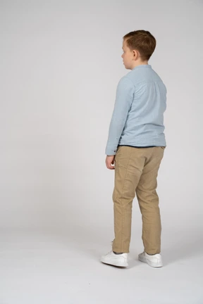 Boy standing back to camera