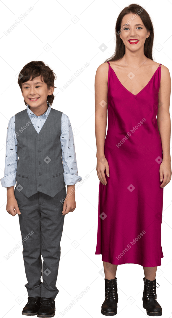 Boy standing with woman