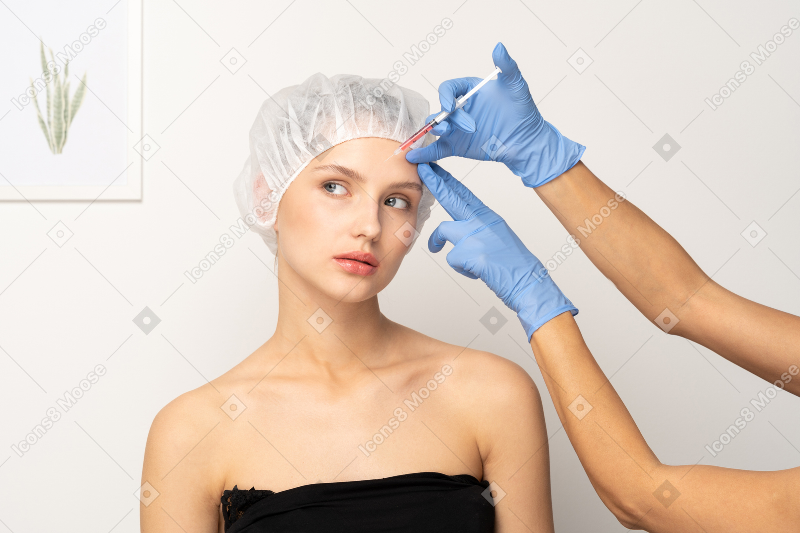Young woman getting filler injection