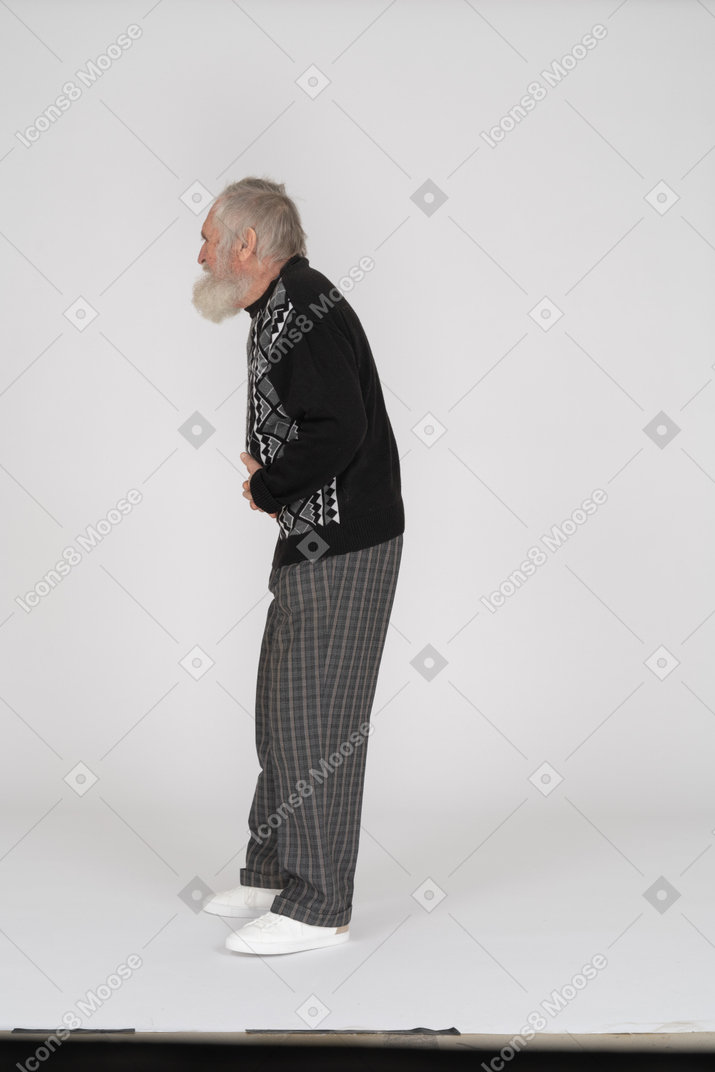 Side view of old man groaning with stomachache