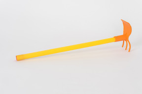 Yellow and orange rake on white background