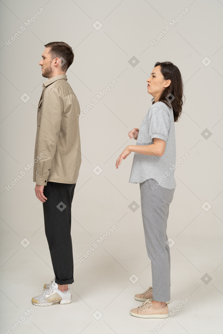 Side view of young couple being squeamish