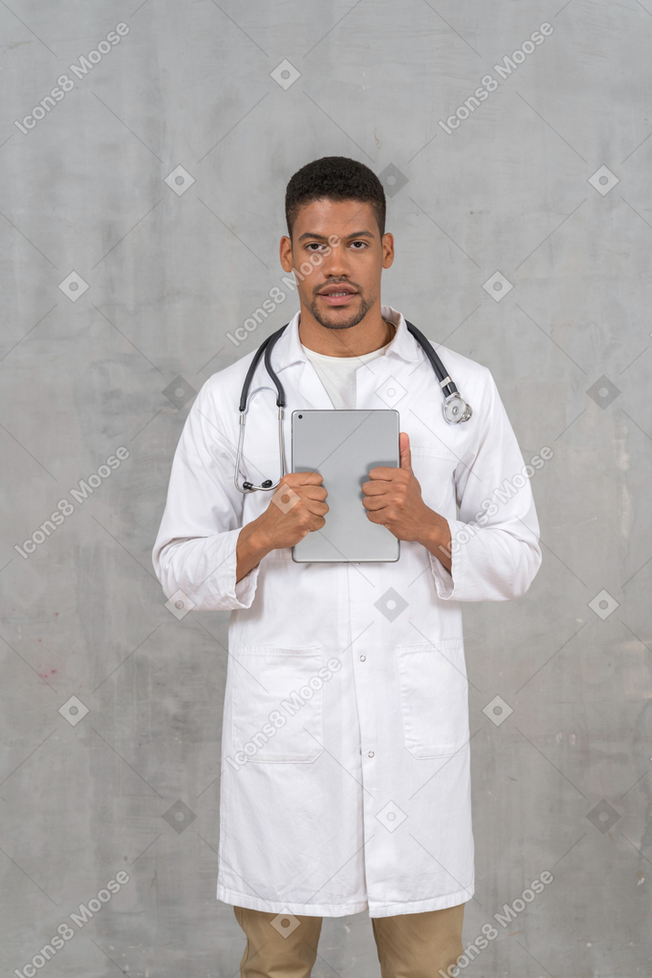 Male doctor talking at the camera