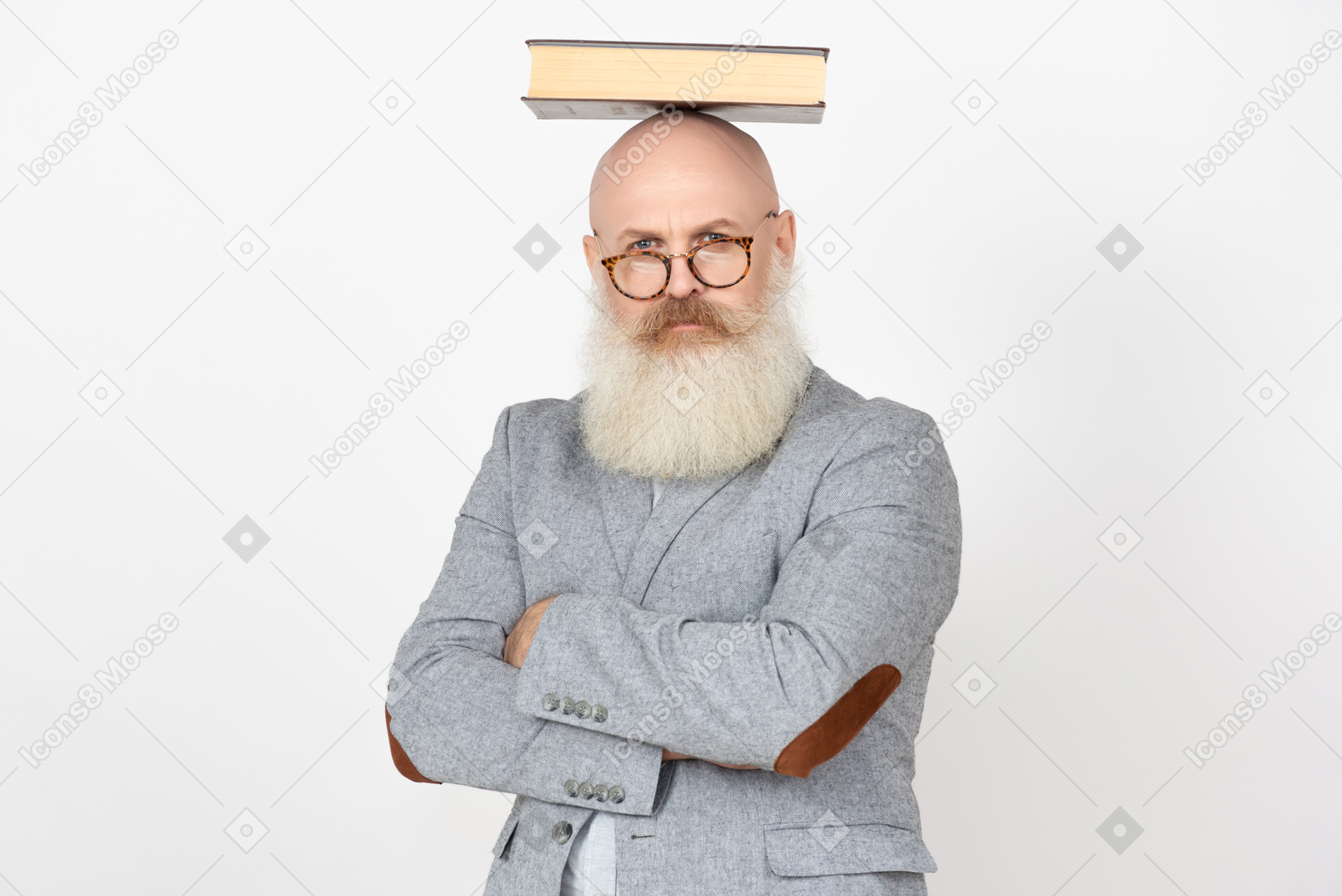 Serious looking mature professor holding book on his head