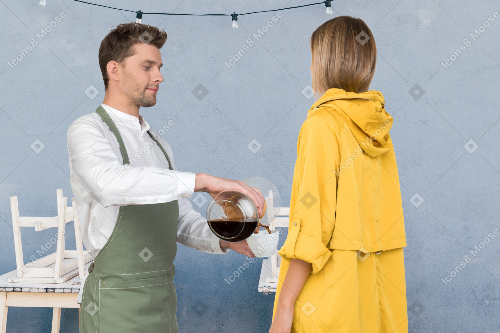 A man pouring a cup of coffee to a woman