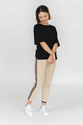 Smiling young woman standing