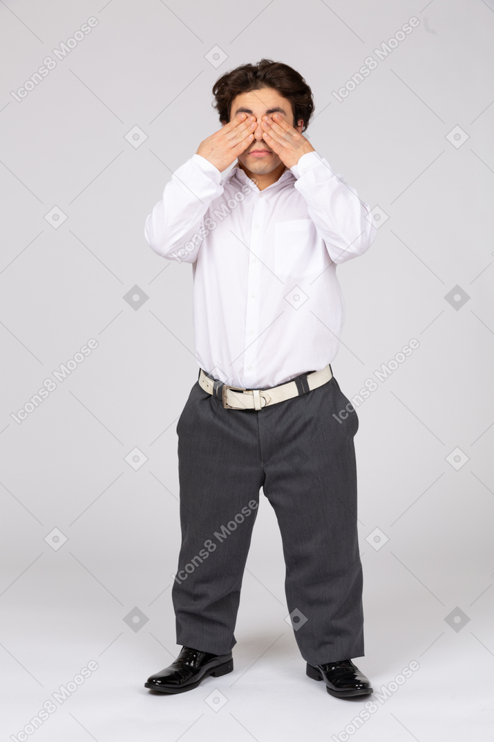 Man closing eyes with hands