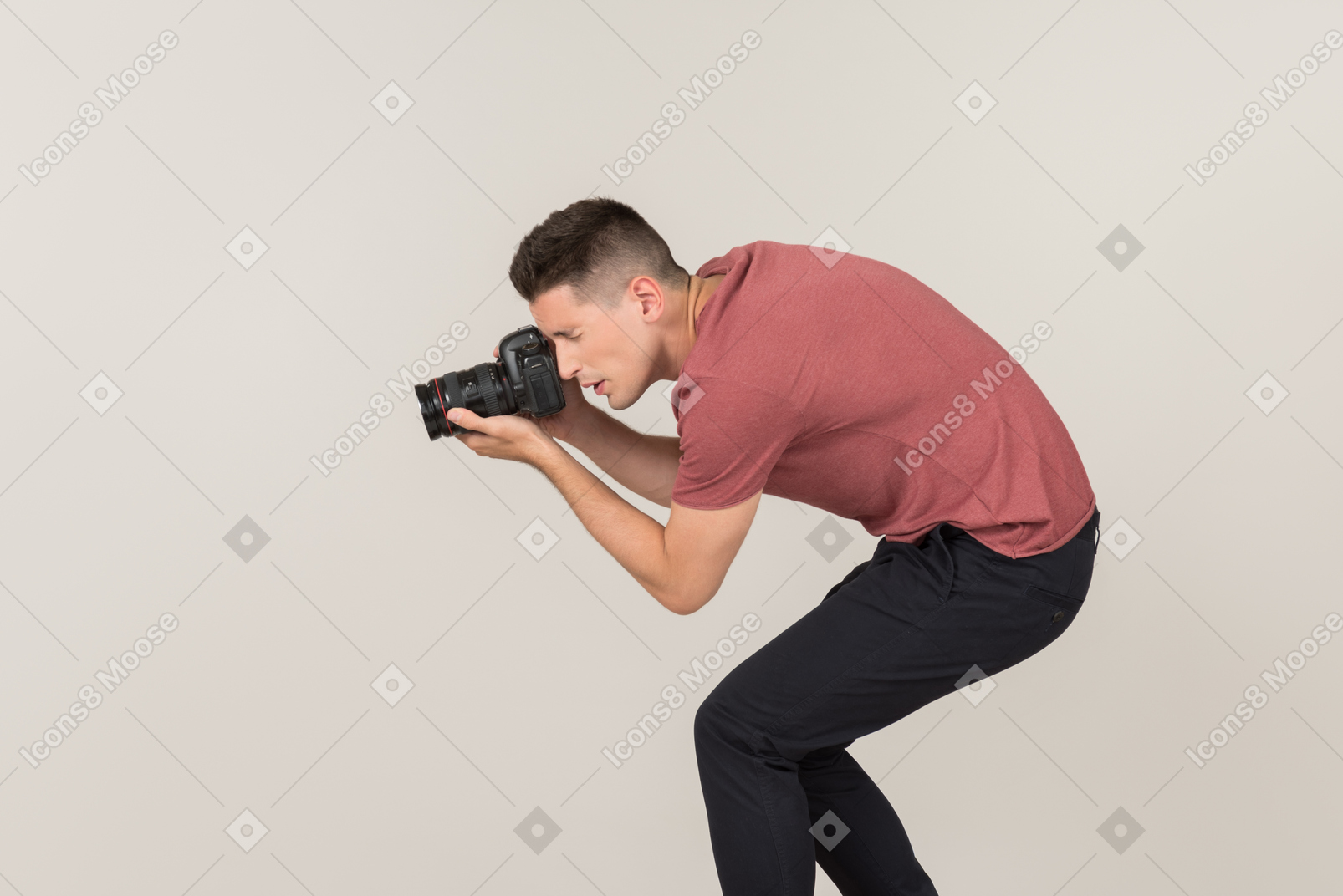 Young guy taking photos with a camera