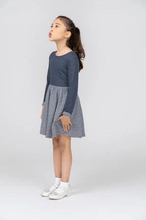 Three-quarter view of a girl making a kissy face