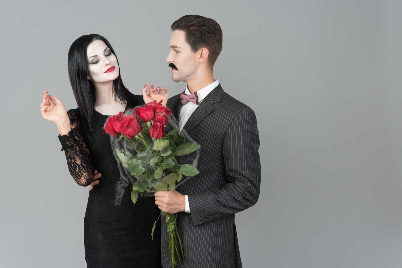 Gomez addams brought bouquet of roses for morticia