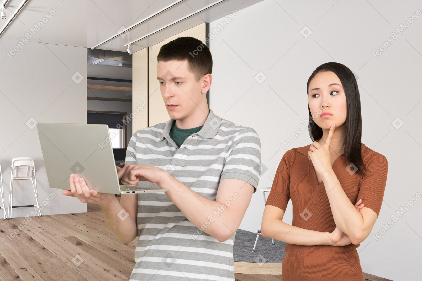 ノートパソコンを見ている男性と女性