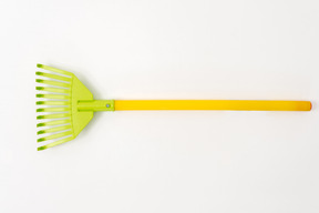 Colourful leaf broom on white background