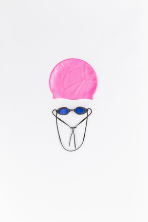 Funny face made of swimming accessories