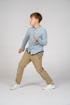 A young boy doing a pose