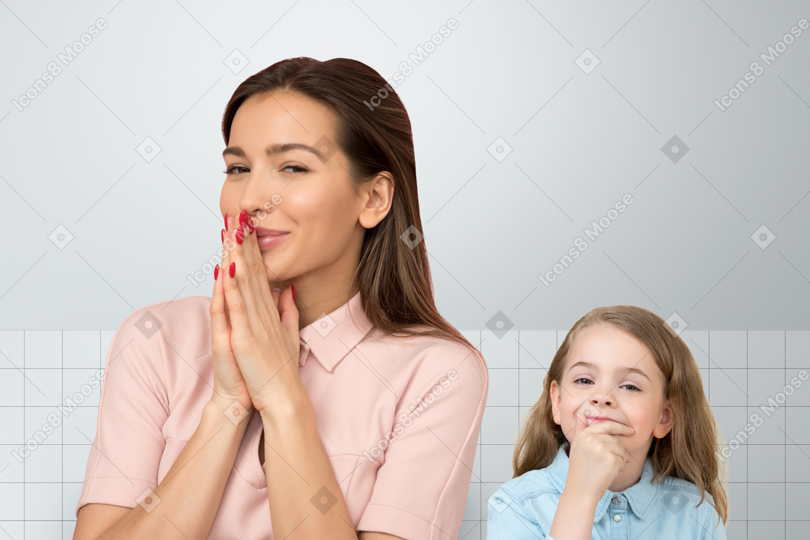 A woman standing next to a little girl who is holding hand on a chin