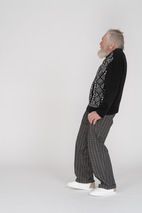 Profile view of a scared elderly man leaning back