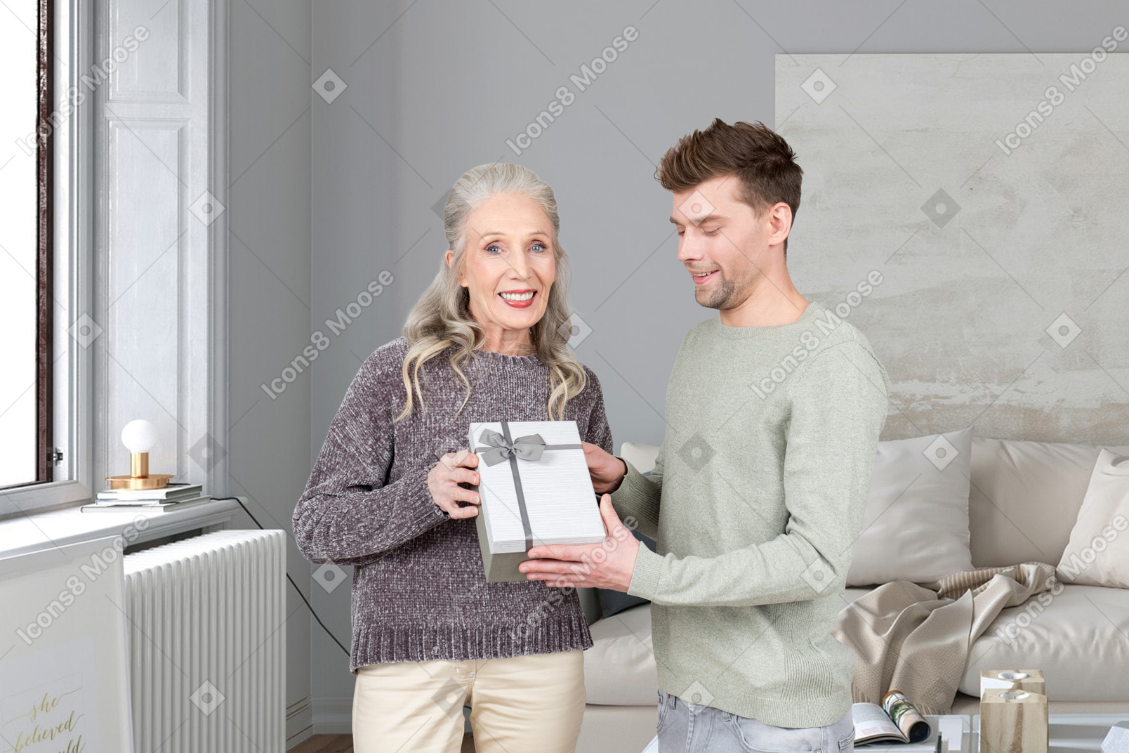 Person and her husband reading a book at their home