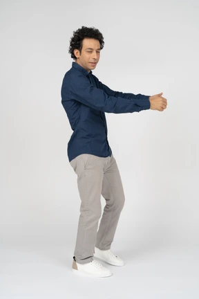 Man in casual clothes posing in profile