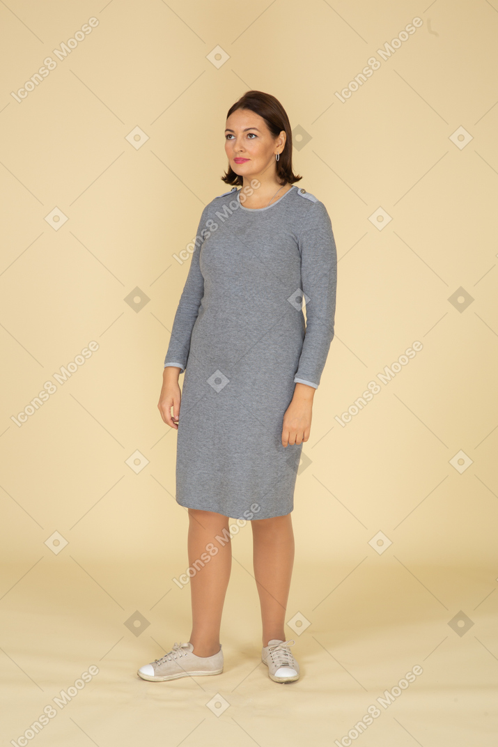 Front view of a woman in grey dress