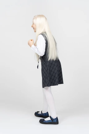 Back view of a schoolgirl looking excited